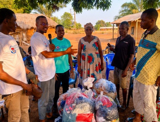 Volunteers presenting donated goods to a family elder