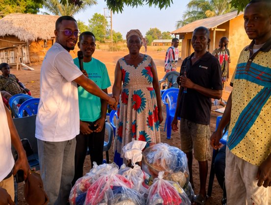 Volunteers and a family posing with bags of donated clothing