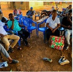 Community members seated together at the close of the event