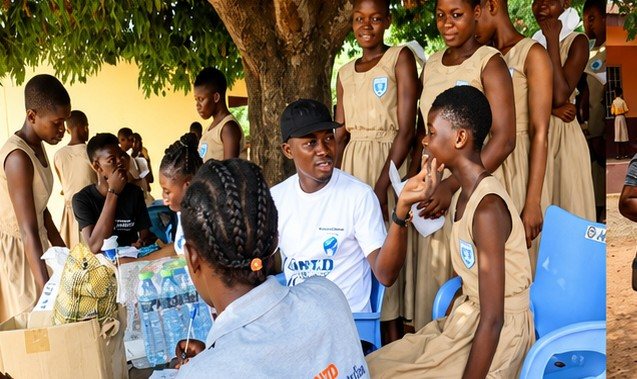 Volunteers distributing hygiene supplies to schoolgirls in Kpando