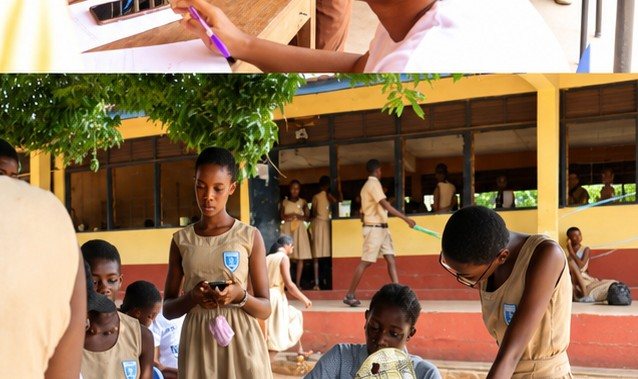 A volunteer checking a pupil's teeth in a school courtyard